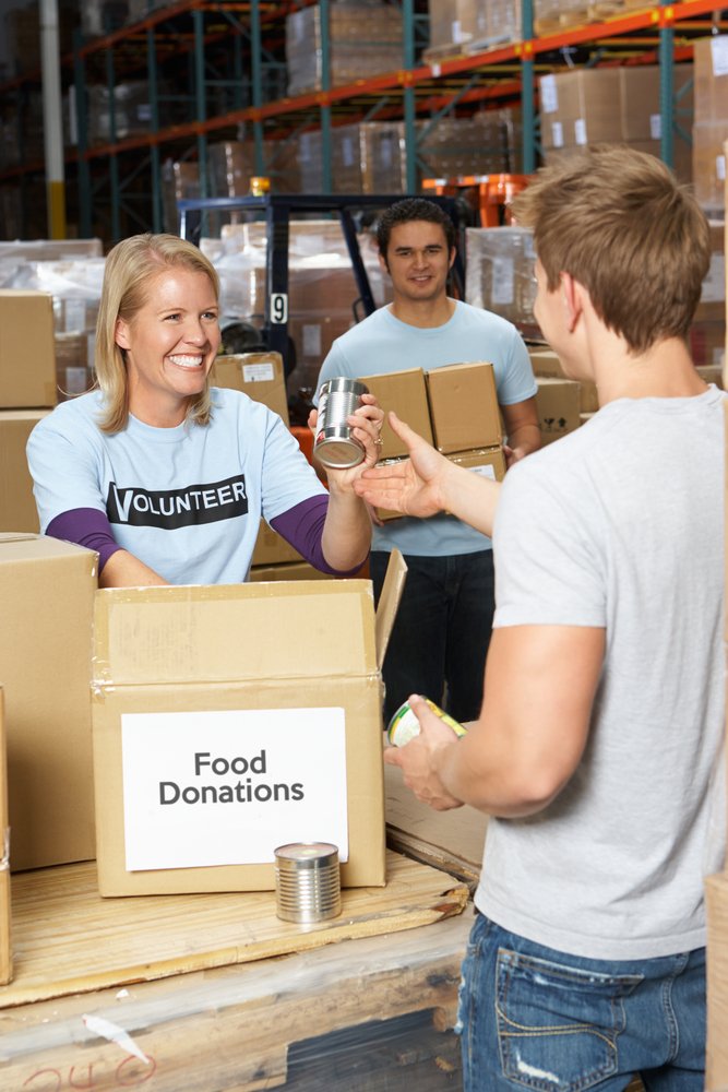 Volunteers,Collecting,Food,Donations,In,Warehouse