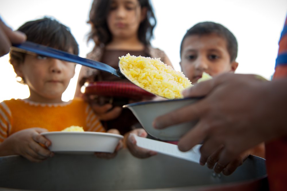 Hungry,Children,Being,Fed,By,Charity