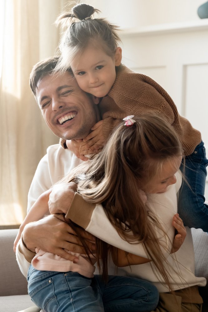 Vertical,Image,Playful,Little,Children,Embracing,Cuddling,Joyful,Father,,Welcoming
