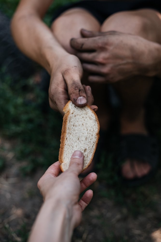 Helping,The,Homeless,Poor.,Moment,Of,Kindness:,Offering,Bread,To